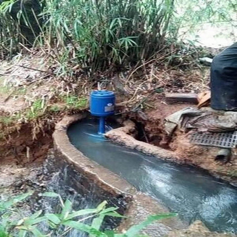 20kW Axial Flow Hydroelectric Generator for Home Power 220V Genny installed near river stream, pure copper core visible.