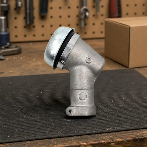 Beefy Gearbox Drive Head Assembly for Grass Trimmer with aluminum and steel construction, Husqvarna style, on workbench.