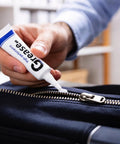 Applying Pro Grade Zipper Lubricant That Works Waterproof Zipper Lube For Metal And Plastic Zippers Universal Zipper Grease Wax to a zipper