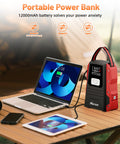 All In One Jump Starter With Air Compressor Portable 12V Battery Pack for 9 Liter Gas and 8 Liter Diesel Engines next to laptop