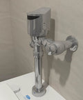 AquaSense ZER TM Series Exposed Sensor Flush Valve With Gear Driven 1.1 GPF Diaphragm Water Closet For Ultra Efficient HET Flushing IP65 Protected Electronics Clog Resistant Diaphragm Durable Mechanism Built For 500000 Cycles, chrome wall-mounted sensor valve