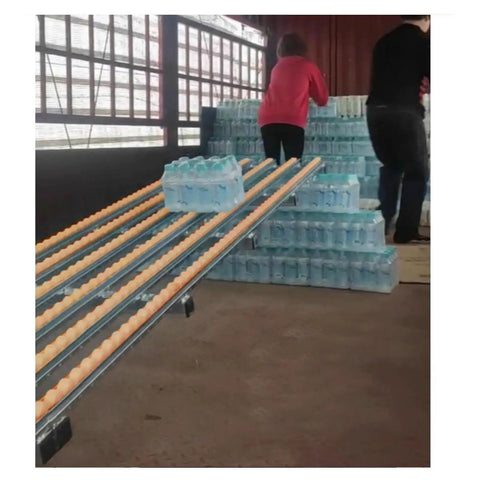 No Sweat Gravity Roller Unloading Ramp With Durable Steel Frame And Smooth ABS Tracks, used for unloading water bottles.
