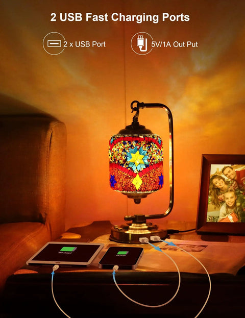 Turkish Mosaic Table Lamp With 7 Color LED, 360 Rotating Moroccan Glass Light, Handmade Boho Bedside Lamp beside two charging devices.
