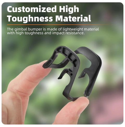Close-up of hand holding Quick-Release Gimbal Bumper For NEO Drone, durable grey finish, lightweight and anti-collision material.