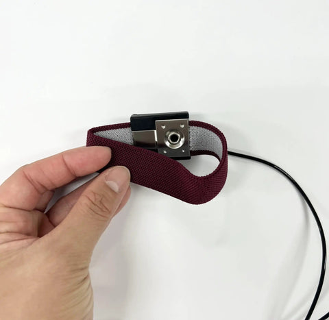 Hand holding Anti Static Wrist Strap Band With Grounding Wire For ESD, Adjustable All Day Comfort, 1M Ohm Resistance