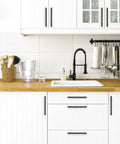 Modern kitchen with 10 Pack Matte Black Square Cabinet Pulls Stainless Steel Kitchen Cupboard And Dresser Handles installed on white cabinets.