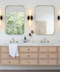 Black And Brass Wall Sconces Set Of Two With Frosted Glass Shades for bathroom decor above vanity mirrors.