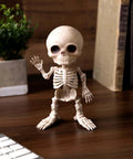 7 Inch Mini Skeleton With Articulated Neck And Shoulders, Weathered Bone Look, Durable All Weather Plastic, freestanding on desk