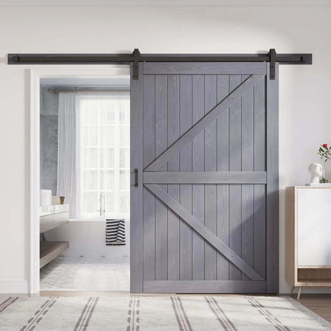 Gray Wood Barn Door Slab 54x84 Inches With 9 Foot Barn Door Hardware Track Kit Included, installed in a modern room