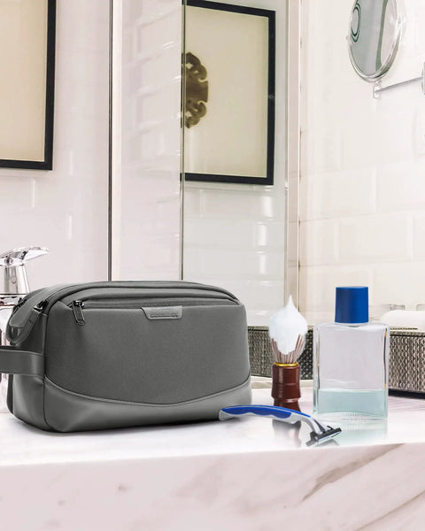Large Travel Toiletry Organizer For Men With Water Resistant PU Leather Trim in a bathroom setting