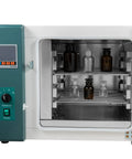 Interior view of the 12 Gallon Digital Convection Oven 1000W Industrial Lab Heat Treatment Drying Machine with glass and brown bottles.