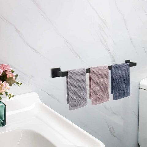 33 Inch Matte Black Stainless Steel Towel Bar Wall Mount Rack For Bathroom with hanging towels, mounted on a white wall.