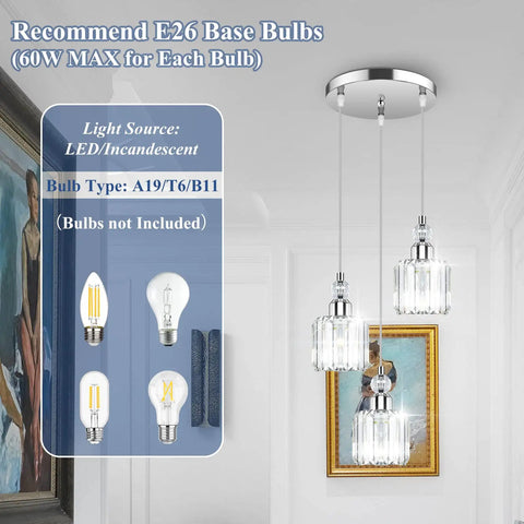 Modern Three Light Crystal Cluster Pendant Chandelier For Kitchen Island Dining Room Table Adjustable Hanging Lights In Chrome With Cords You Can Tweak Up To Fifty Three Inches For Perfect Height, shown with recommended E26 bulbs.