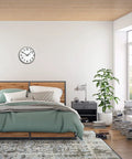 Bedroom with bed, side table, and wall clock made with Two Quartz Clock Mechanisms Kit With Five Hands No Battery Required Replacement Movements