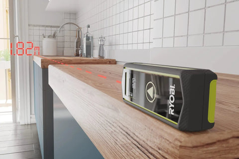 Pro 20 Meter Laser Distance Meter With Clear Digital Screen And Continuous Measurement Mode on wooden surface showing 1.82m distance.