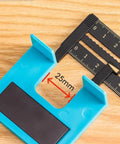 Close-up of a Magnetic Door Hinge Jig Kit For Quick Installations No Drill Mortise Tool with a 25mm measuring guide, blue plastic component.