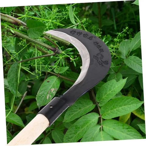 Grass Scythe With Manganese Steel Blade And Long Handle For Easy Weeding And Lawn Care, shown cutting through green foliage.