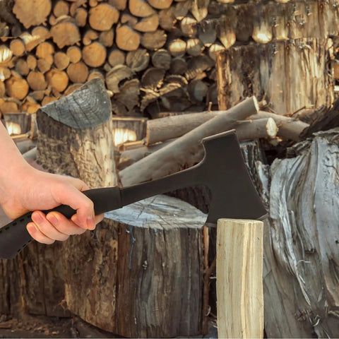 Person using Durable Camping Hatchet Full Tang Axe For Wood Splitting Kindling And Campfire Chops.