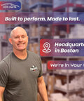 EDS Parts representative in a warehouse, smiling, wearing a gray shirt for automotive components.