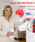 Woman using 400 Piece First Aid Kit With Dual Layer Wall Mount Case For Home Car Travel Camping Hiking Truck Office Sports And Outdoor Emergencies Ready To Grab And Go in living room, kit mounted on wall.