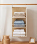 Top Quality Double Pack Hanging Closet Organizer With Three Tier Foldable Build To Store Fresh Threads And Keep Your Wardrobe Crisp While Clearing Tight Spaces For Smarter Home Layout Wins, displaying neatly folded clothes in beige organizer.