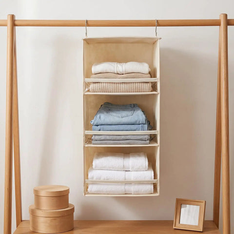 Top Quality Double Pack Hanging Closet Organizer With Three Tier Foldable Build To Store Fresh Threads And Keep Your Wardrobe Crisp While Clearing Tight Spaces For Smarter Home Layout Wins, displaying neatly folded clothes in beige organizer.