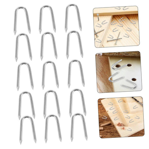 50 Pack U Shaped Fence Staples For Quick Install And Strong Hold Durable Metal Garden Stakes For Fences Landscaping And DIY Projects Multi Function Iron Pegs on wooden surface