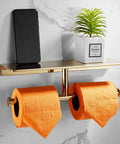 Double Roll Toilet Paper Holder With Shelf In Solid Brass And Polished Gold Finish, Hotel Style Tissue Dispenser, with orange rolls