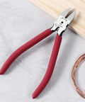 6 Inch Ultra Sharp Side Cutter Snips With Extra Long Flush Cutting Edge For Clean Flat Cuts, red handles, near copper wire