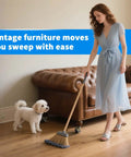 Woman cleaning with a broom by vintage furniture, showcasing Heavy Duty Two Inch Brass Ball Casters With Locking Brakes.