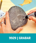 Diamond Point Engraver Bit For Rotary Tools Perfect For Engraving Metal Glass And Wood being used to engrave fish on stone