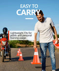 Man setting up 12 Pack 18 Inch Traffic Safety Cones With Reflective Collars, Durable PVC Construction, Orange Cones