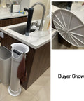 Heavy Duty Espresso Knock Box With Quick Release Drip Tray And Premium Barista Towel near a kitchen sink with a brown towel hanging on it.