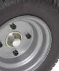 Close-up of Heavy Duty Electric Powered Tugger tire, sturdy design for moving heavy trailers and carts at airports.