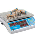 Digital 60 Pound Electronic Coin And Parts Counting Scale With Stainless Steel Platform and Bright LED Display showing counted coins.