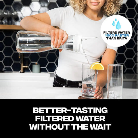 Person pouring water from Glass Water Pitcher With Carbon Filter 1.3L Capacity For Fast Filtration Removes Lead Odors Chlorine Long Lasting Filter 2 Pack Included For Crisp Clean Tap Water into glass