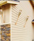 Upgraded Flickering Flame Solar Powered Torches to Light Up Outdoor Gardens and Patios on house wall in bamboo weave design