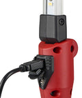 Close-up of the red handle and charger port on the Strion Switchblade 500 Lumen Rechargeable Compact Multi Function LED Work Light With Color Rite Technology