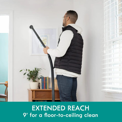 Person using Wet Dry Canister Vacuum Cleaner 3.2 Gallon With 2.5 Peak HP Motor for ceiling cleaning with extension wand