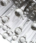 Close-up of raindrop-inspired sparkling K9 crystal glass on a Raindrop Crystal Drum Chandelier With Fabric Shade.