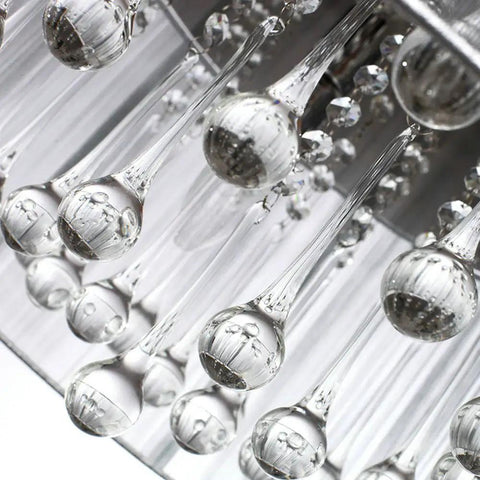 Close-up of raindrop-inspired sparkling K9 crystal glass on a Raindrop Crystal Drum Chandelier With Fabric Shade.