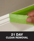 DIY Friendly Pro Grade Multi Surface Painter Tape With PaintBlock Technology For Sharp Lines being removed from trim after 21 days