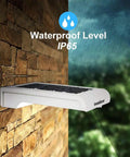 Lit Outdoor Solar Motion Sensor Wall Lights With 24 LEDs, 150 Lumens Ultra Bright Security Lighting For Yard Driveway Porch Patio IP65 Waterproof, Wall Mount, on brick wall in rain, showcasing IP65 waterproof level.