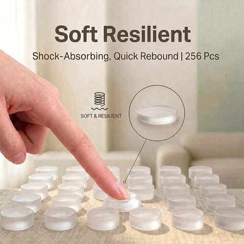 Person pressing a clear silicone cabinet door bumper, 256 Piece Bulk Pack Clear Silicone Cabinet Door Bumpers Sticks Like Glue Half Inch Rubber Furniture Protectors Soft Close Pads To Keep Your Cabinets Chill And Quiet During Everyday Use.