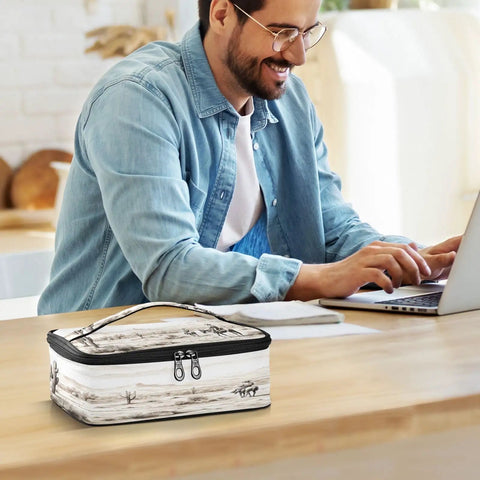 Grab And Go Desert Cowboys Insulated Lunch Bag With Leakproof Cooler on desk beside man using laptop at work.