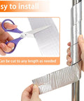 Hands cutting and applying Beefed Up Heavy Duty Pipe Insulation Wrap 2 Inch By 33 Foot Self Adhesive Aluminum Foil to a pipe.