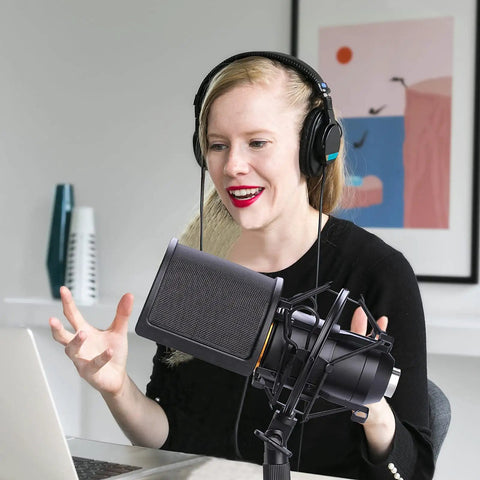 Person using Mic Shock Mount With Pop Filter For 46mm To 51mm Condenser Microphones during a podcast