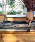 3 In 1 Stainless Steel Bee Hive Tool With J Hook And Box Scraper Knife For Lifting Frames Beekeeping Gear in use on a beehive