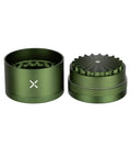 Toothless Herb And Spice Grinder With Extra Storage For Everyday Kitchen Bosses Aircraft Grade Aluminum Manual Grinder Two And A Half Inch Matte Green Finish Smooth Jam Free Grind, open with lid beside base, compact design.