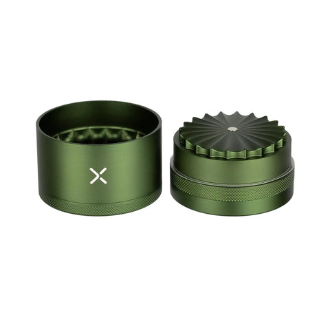 Toothless Herb And Spice Grinder With Extra Storage For Everyday Kitchen Bosses Aircraft Grade Aluminum Manual Grinder Two And A Half Inch Matte Green Finish Smooth Jam Free Grind, open with lid beside base, compact design.